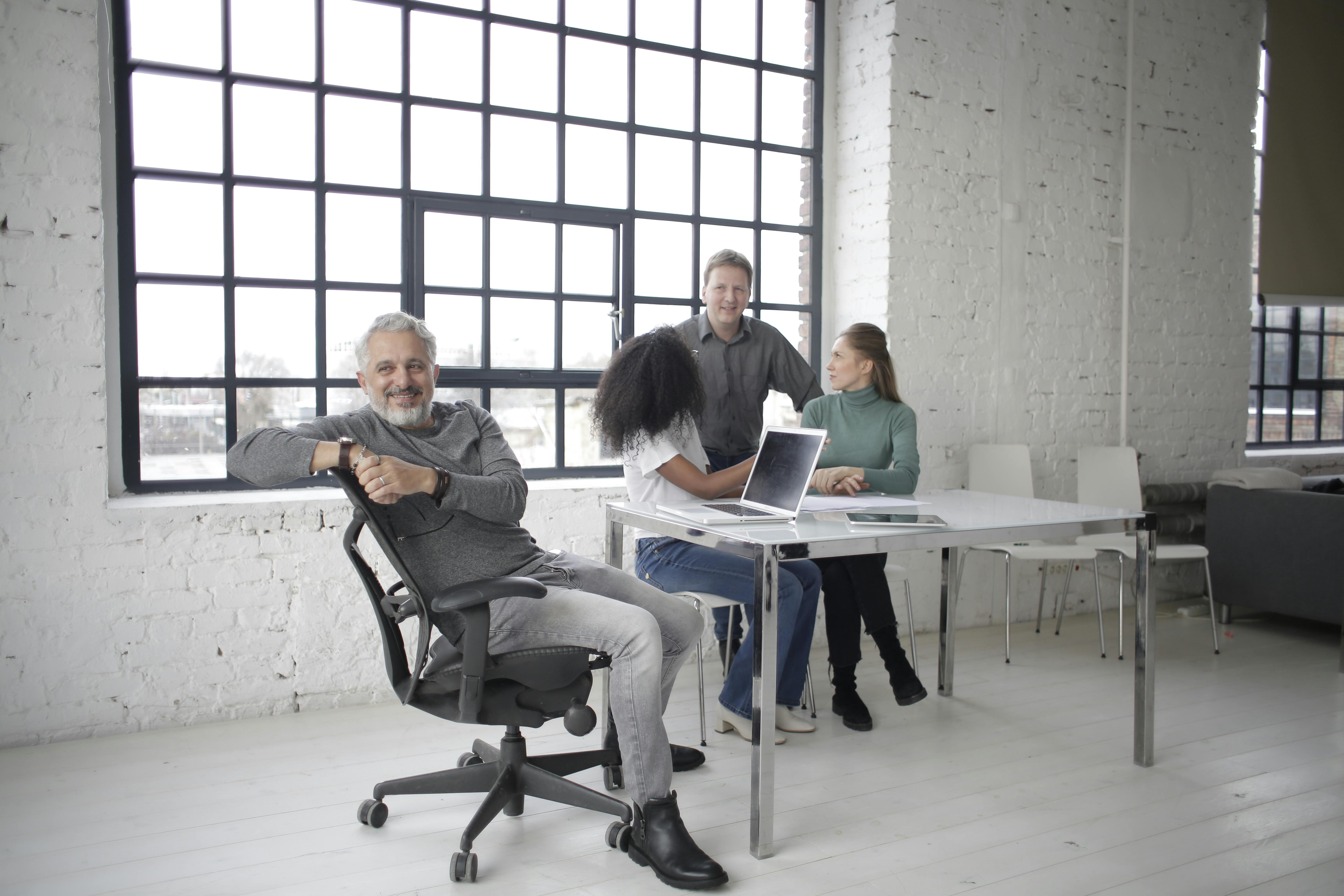Modern office team meeting, representing start-ups and high-growth entities